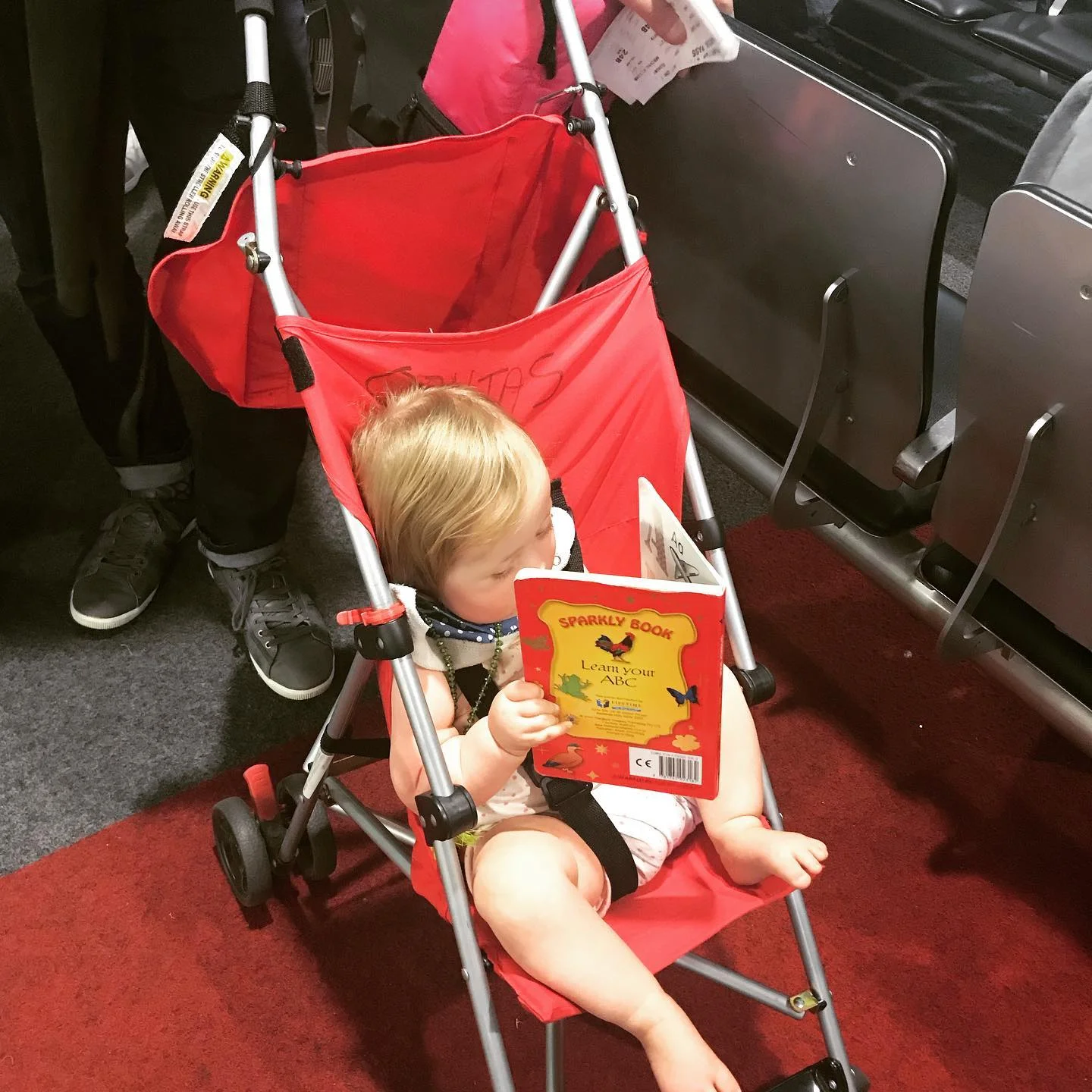 Coraline at Melbourne airport in January 2019, waiting for a delayed internal flight to Canberra.
