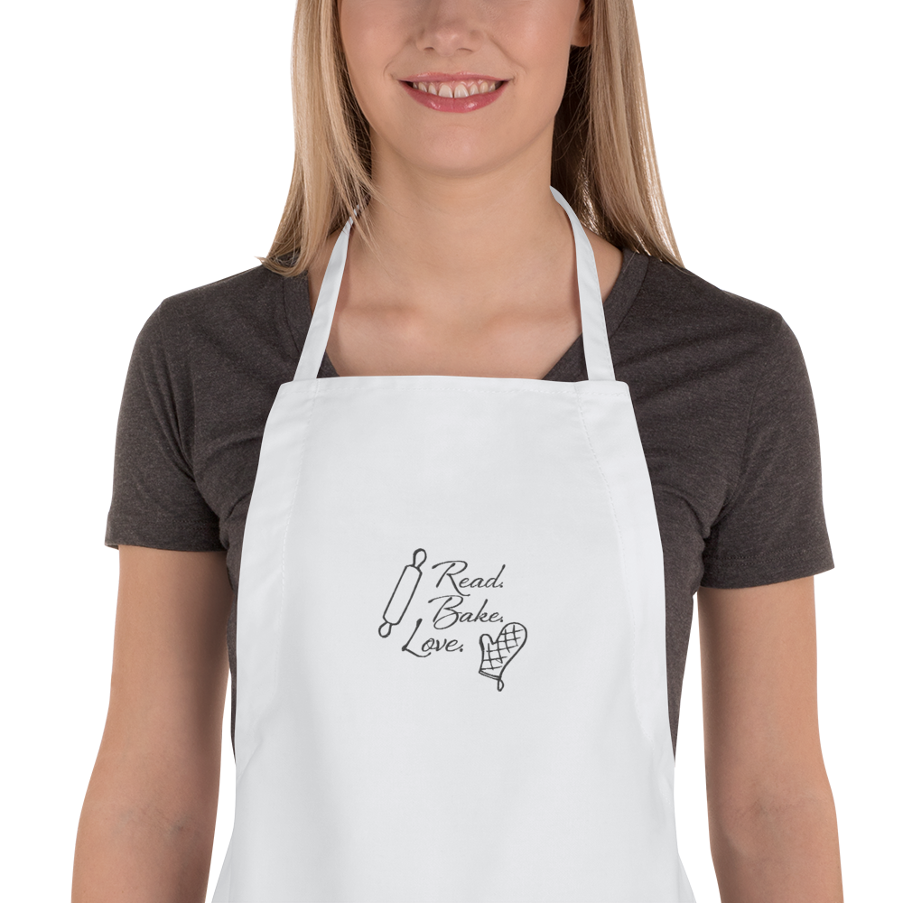 ReadBakeLove_aprons_000000_mockup_Zoomed-in_Womens_White.png