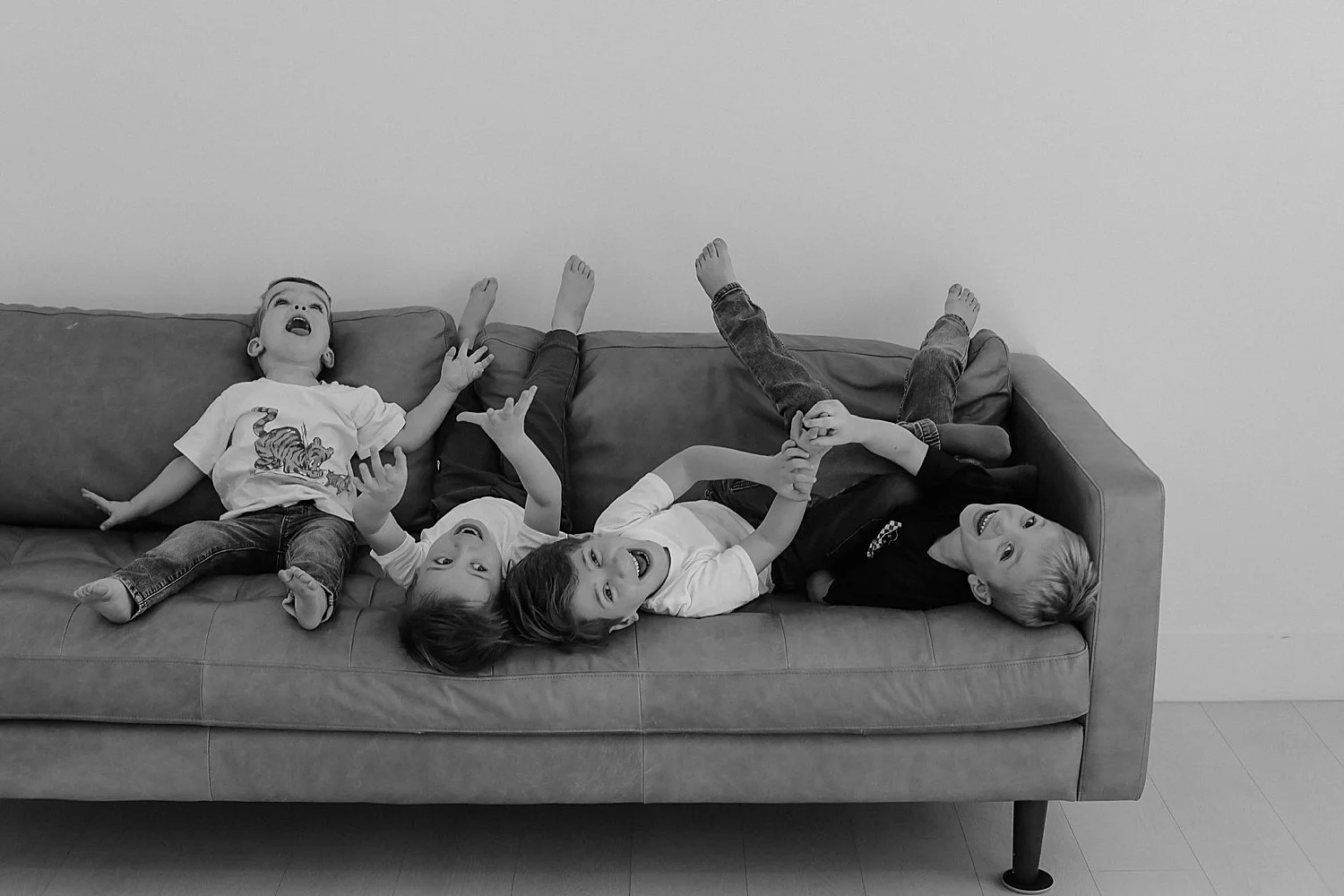  four kiddos giggle on couch together by Jessie Shaw photo  