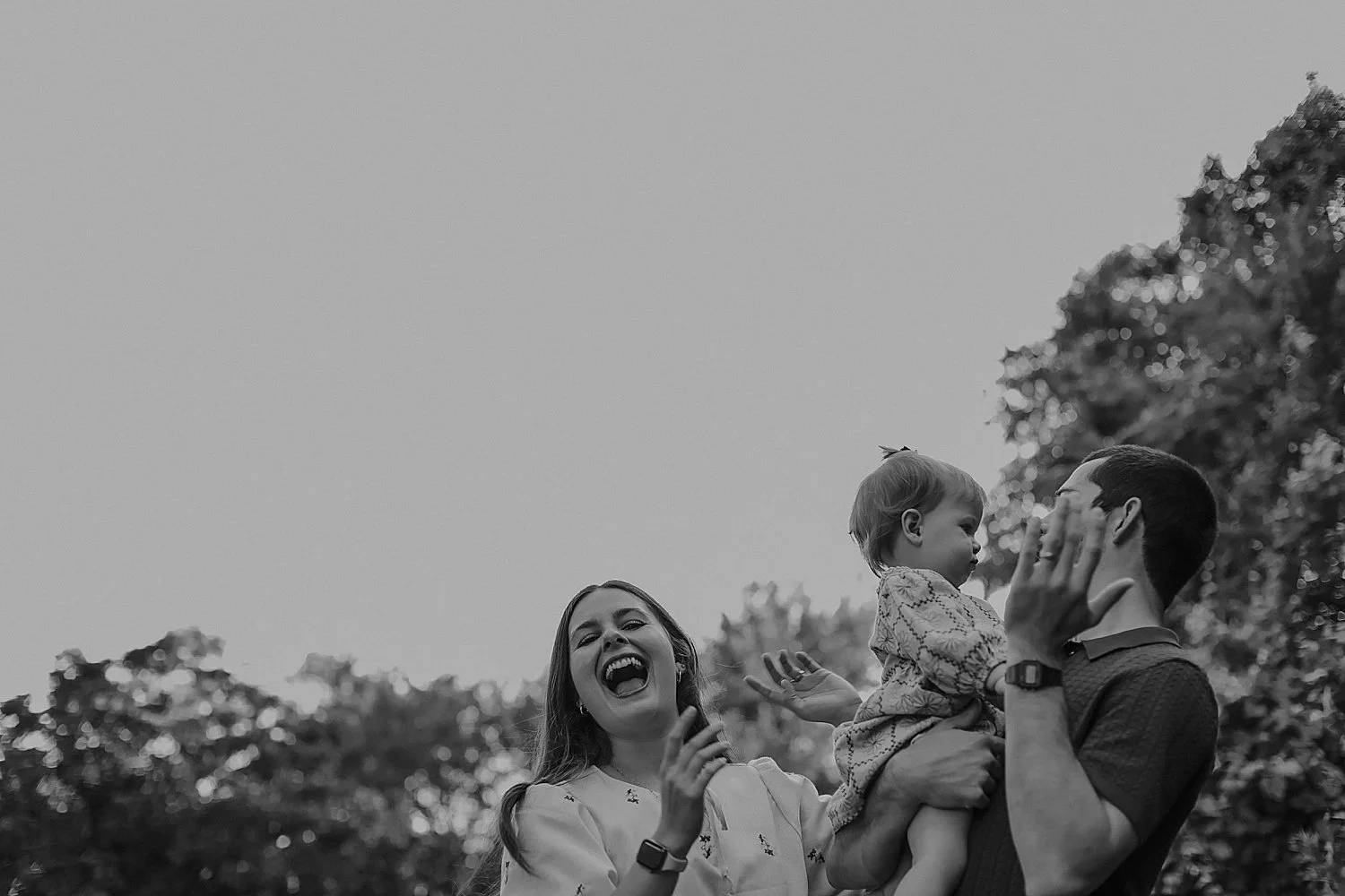  mom laughs as kids play by Jessie Shaw Photo 