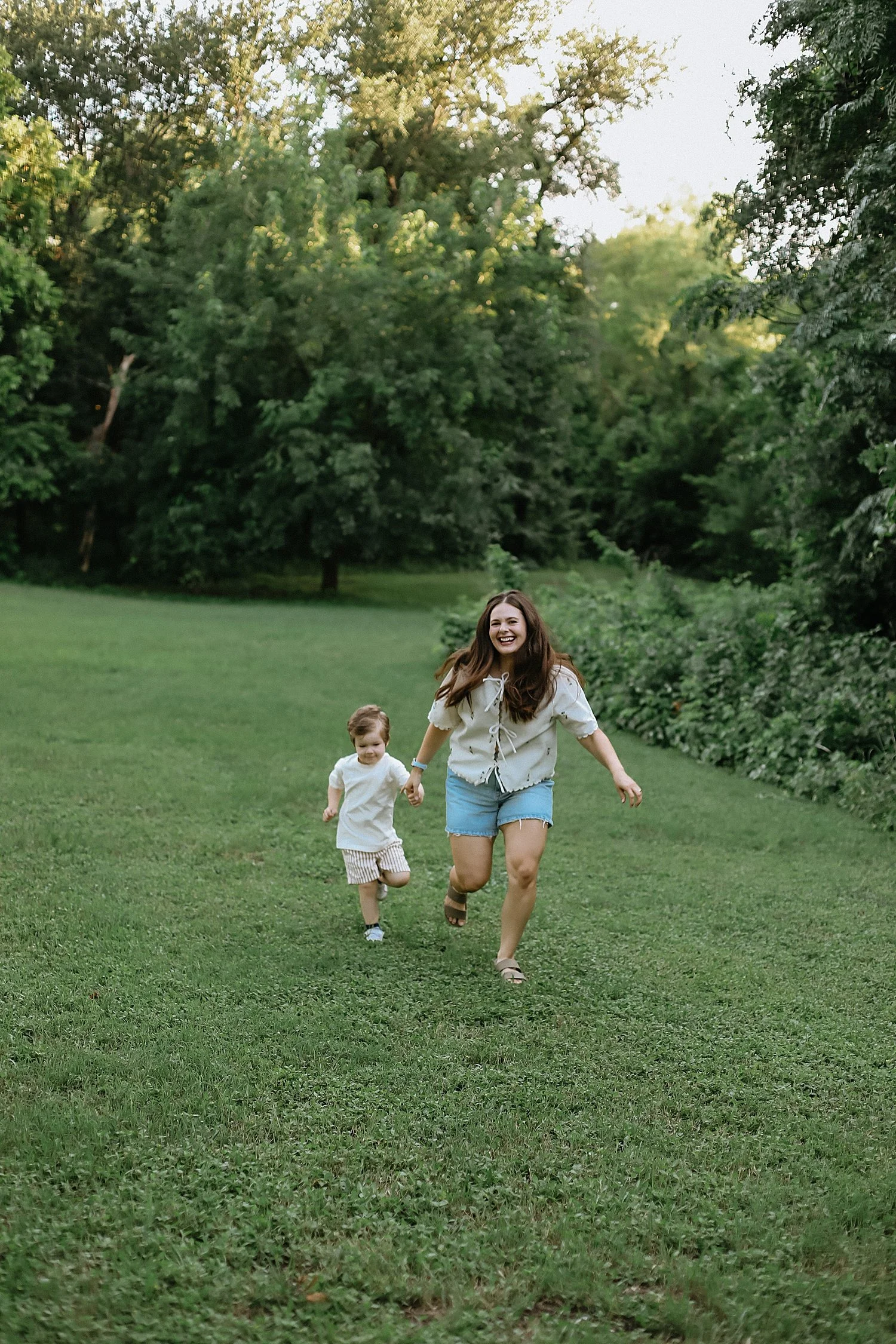  mother and toddler son fun through field by Jessie Shaw Photo 