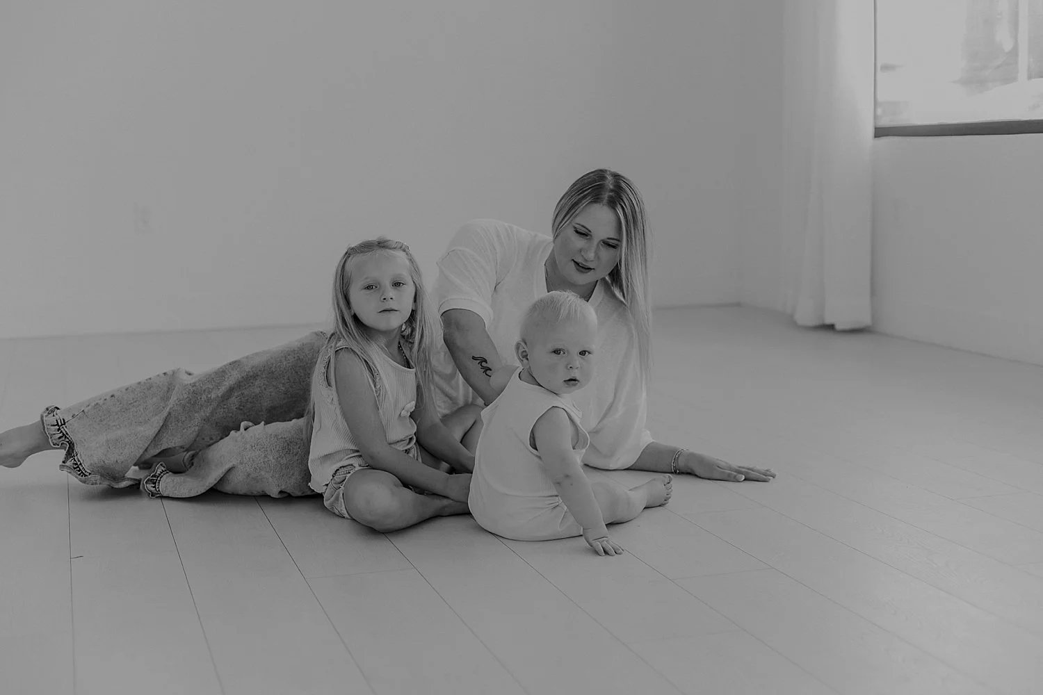  mother sits on floor with her little kiddos by Round Rock Family Photographer 