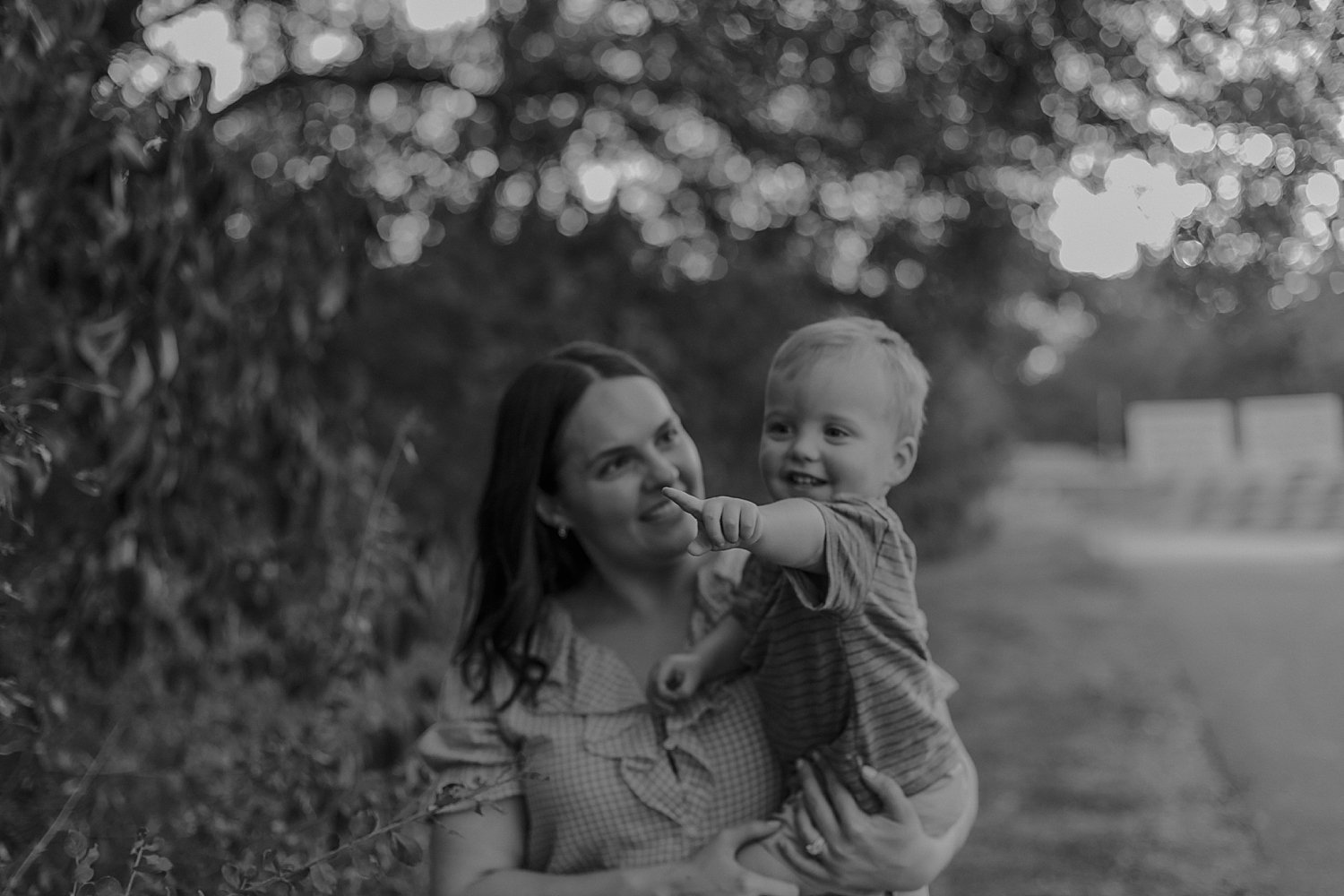  mom and toddler explore trees at Old Settlers Park 
