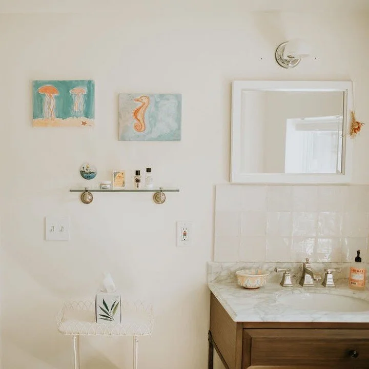 on suite bath to primary bedroom. simple design with rejuvenation sink and cabinet marble top and lovely fixtures throughout bathroom. There is a shower tiled with stone and cle' tiles above sink.

#simpleliving #bathrooms #cletiles 

photos by jenna