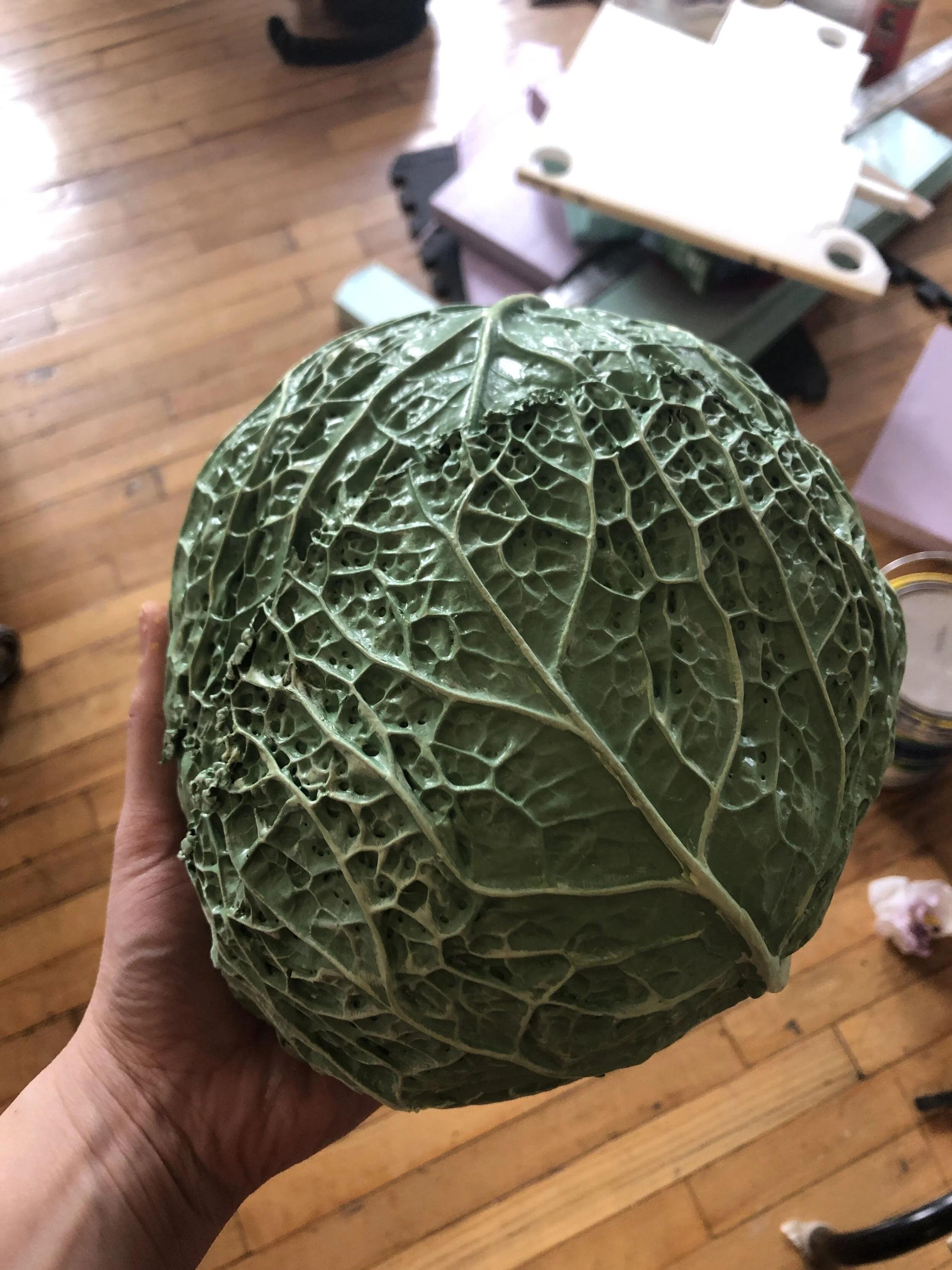 Hand painted to look like savoy cabbage.  We created multiple plaster and rubber molds to achieve the different looks.