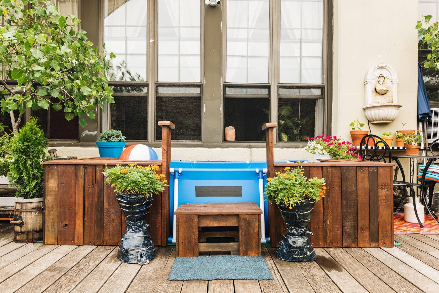  Reclaimed bench seating surrounding pool by Fab Props 