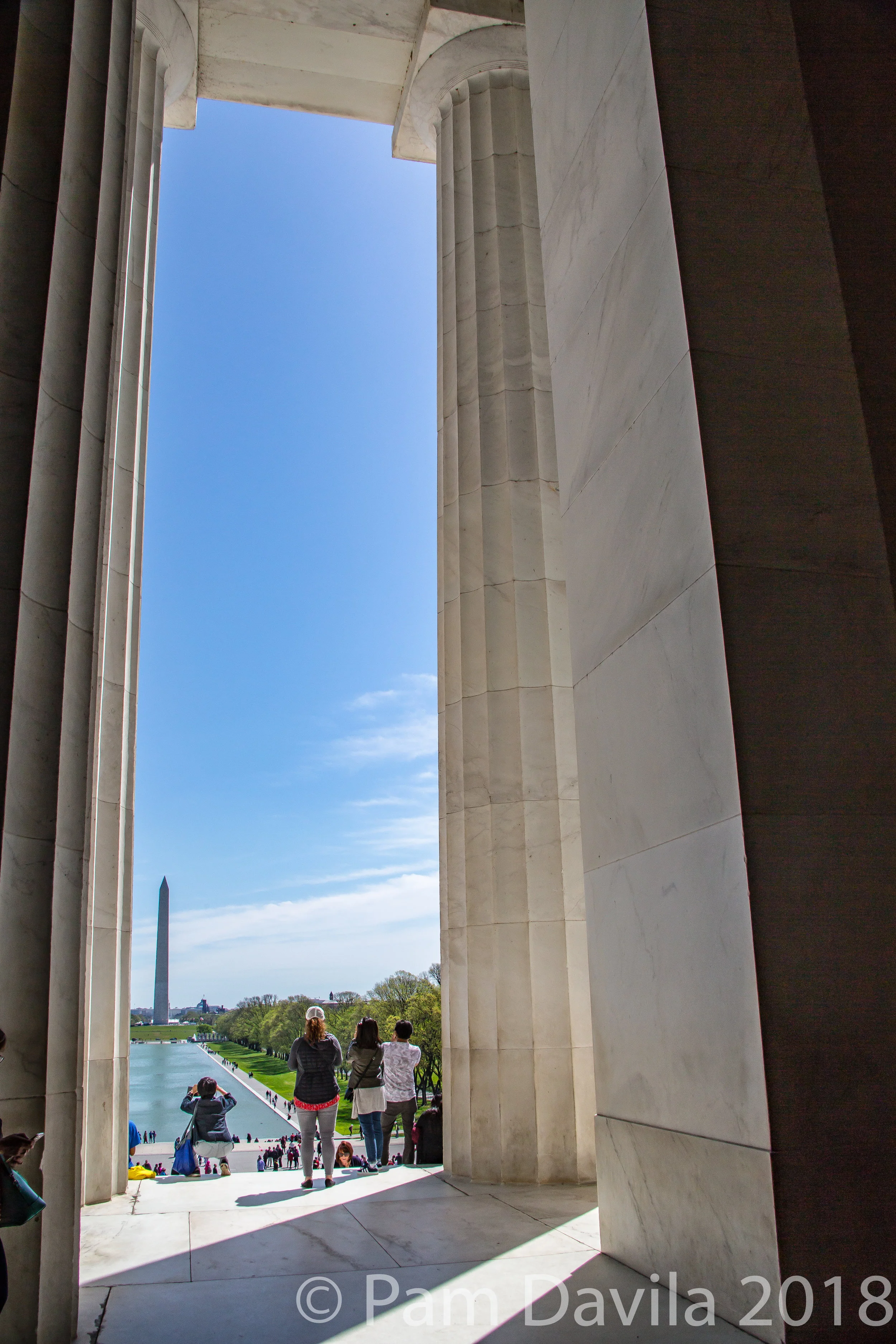  View of the Washington Monument and the reflecting pool as seen through the marble columns of the Lincoln Memorial, April 2018 