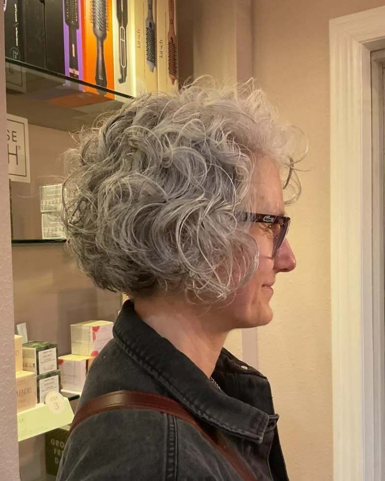 What a gorgeous silver curly cut by Heather! 
She used Davines Curl Building Serum and a diffuser to achieve this look. 

#sylvaniasalon #toledosalon #sylvania #sylvaniabusiness #willowcreeksalon #willowcreek  #curlyhair #silverhair