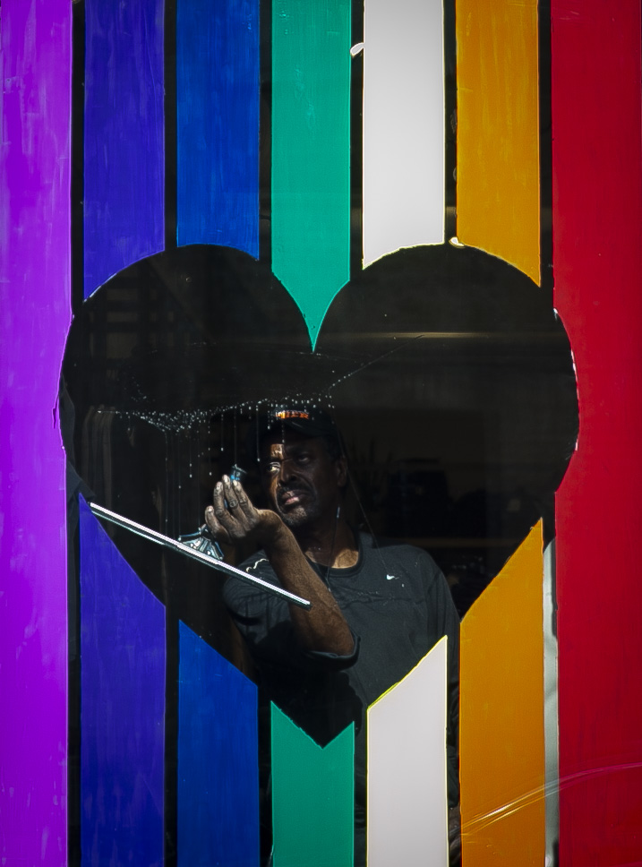  Michael Johnson, 60, cleans the windows for Lululemon on N. Sangamon in Chicago's West Loop neighborhood on Tuesday, July 9, 2019. North Carolina-based investor, Asana Partners, is entering the Chicago market by buying more than $100 million worth o