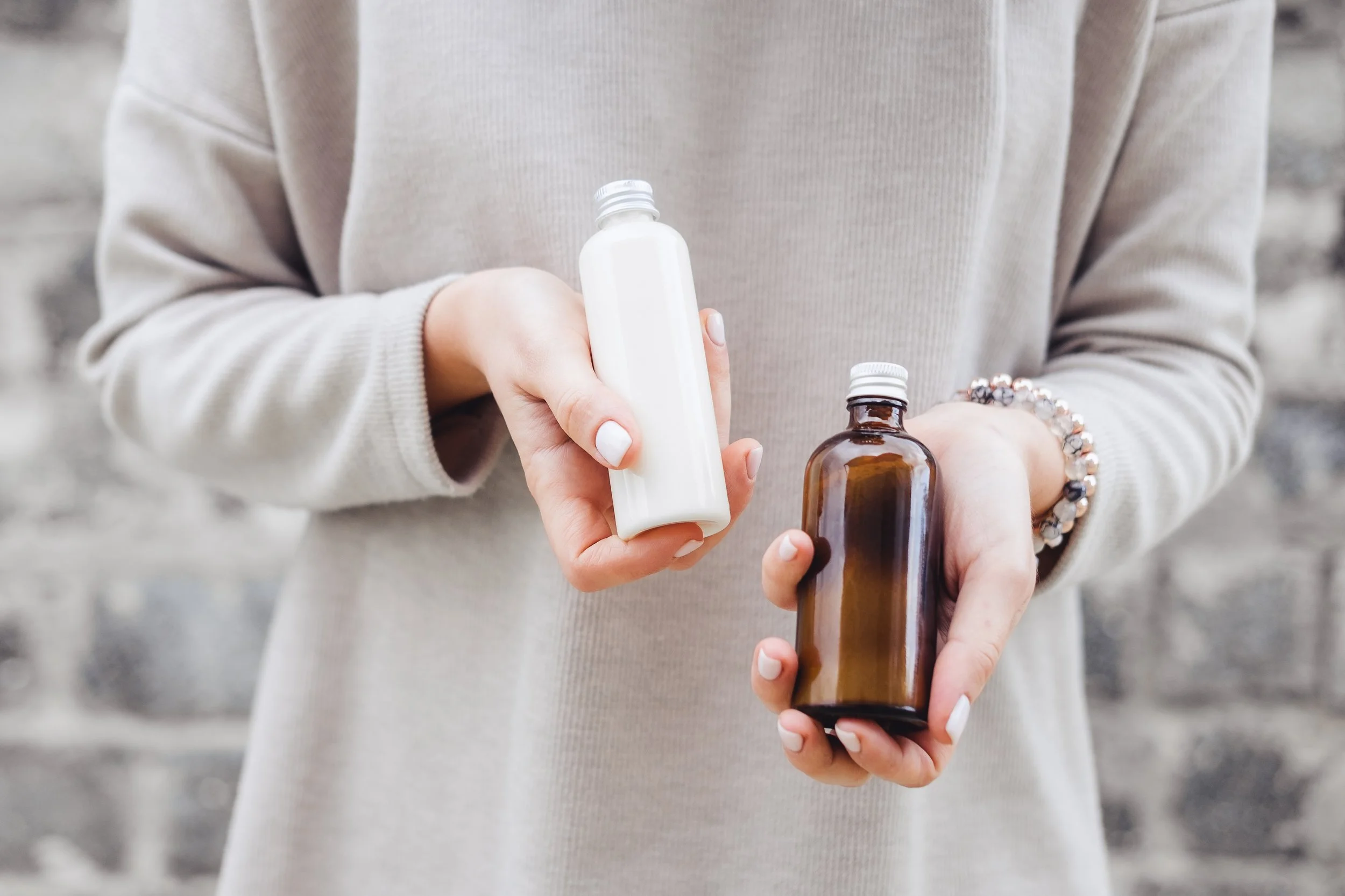womans-holding-botles-with-spa-cosmetics-against-gray-wall-beauty-blogger-salon-therapy-minimalism_t20_Ggk8zY - Copy.jpg