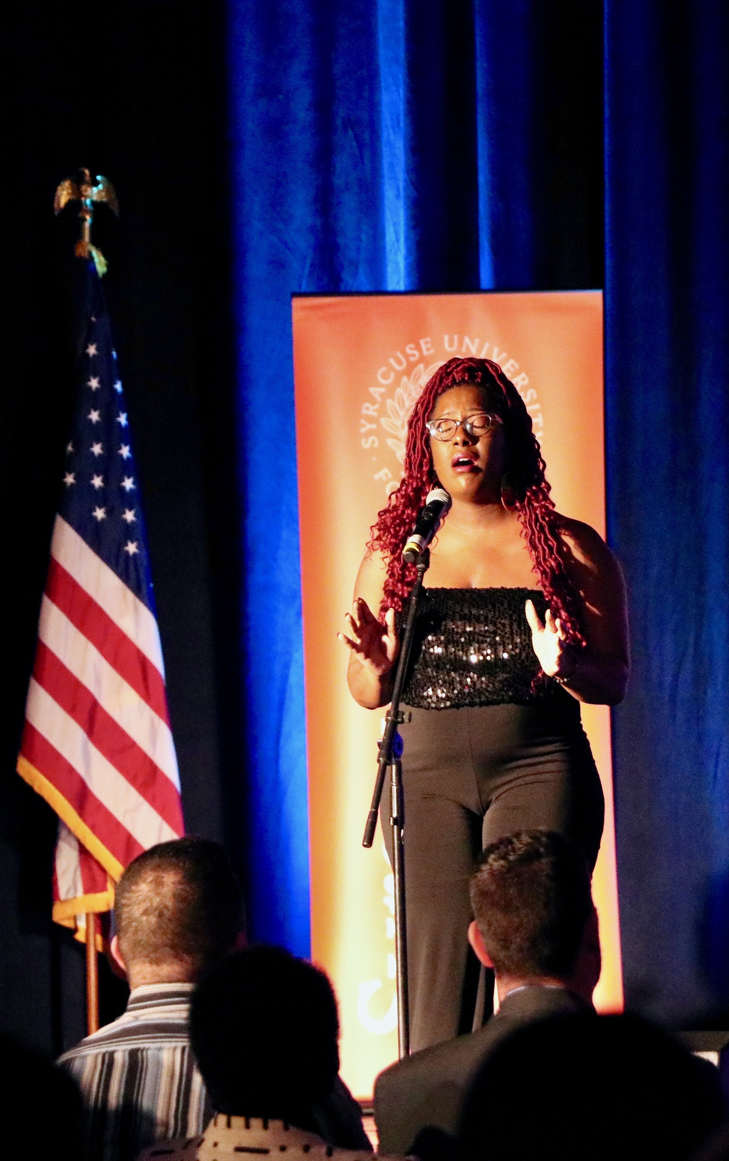 A member of A.N.G.E.L.S performs, singing the names of individuals who were victims of violence inflicted on black communities: “We looked around and they were gone.“ Photo by Saniya More.