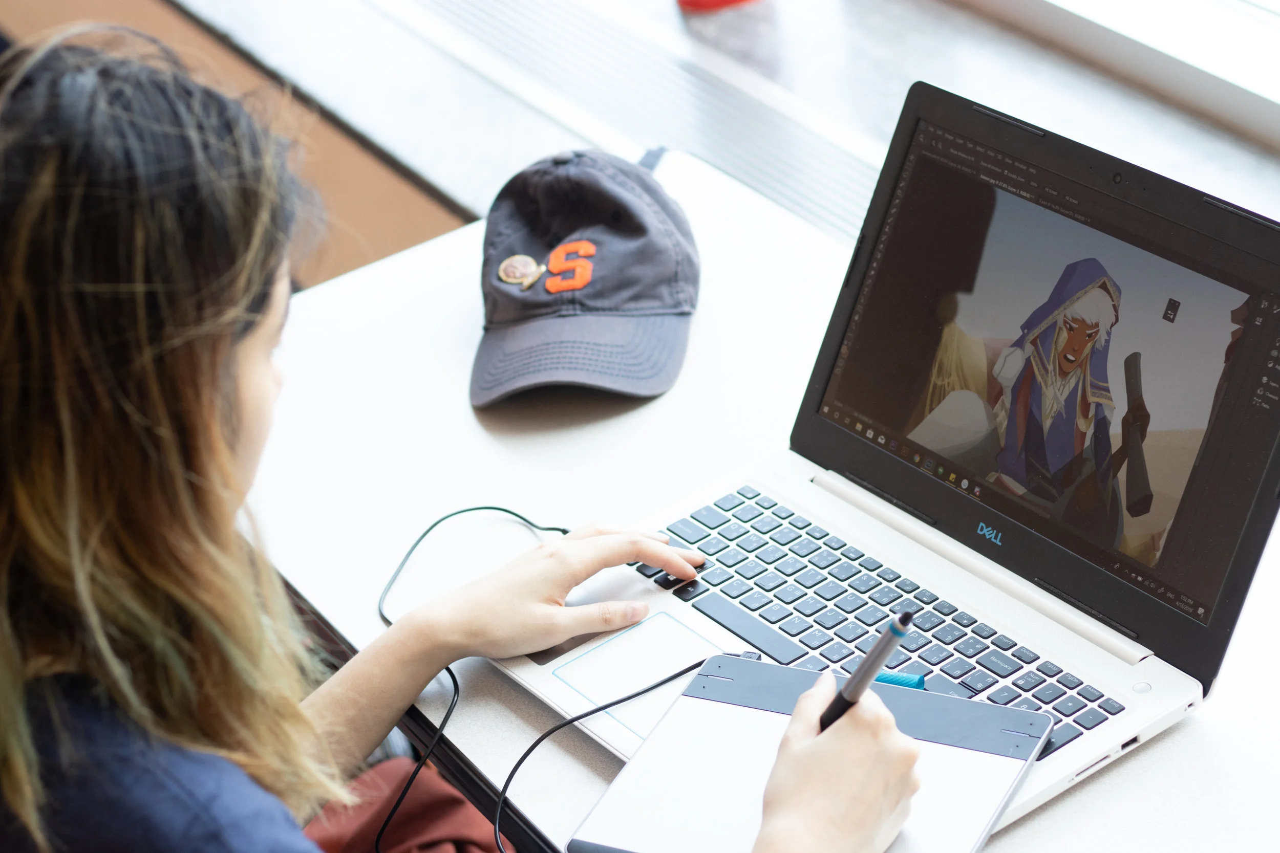 Suwiwatchai, an international Thai architecture student, works on an animation at her computer with her graphics drawing pad. Photo by Marijke Pieters-Kwiers