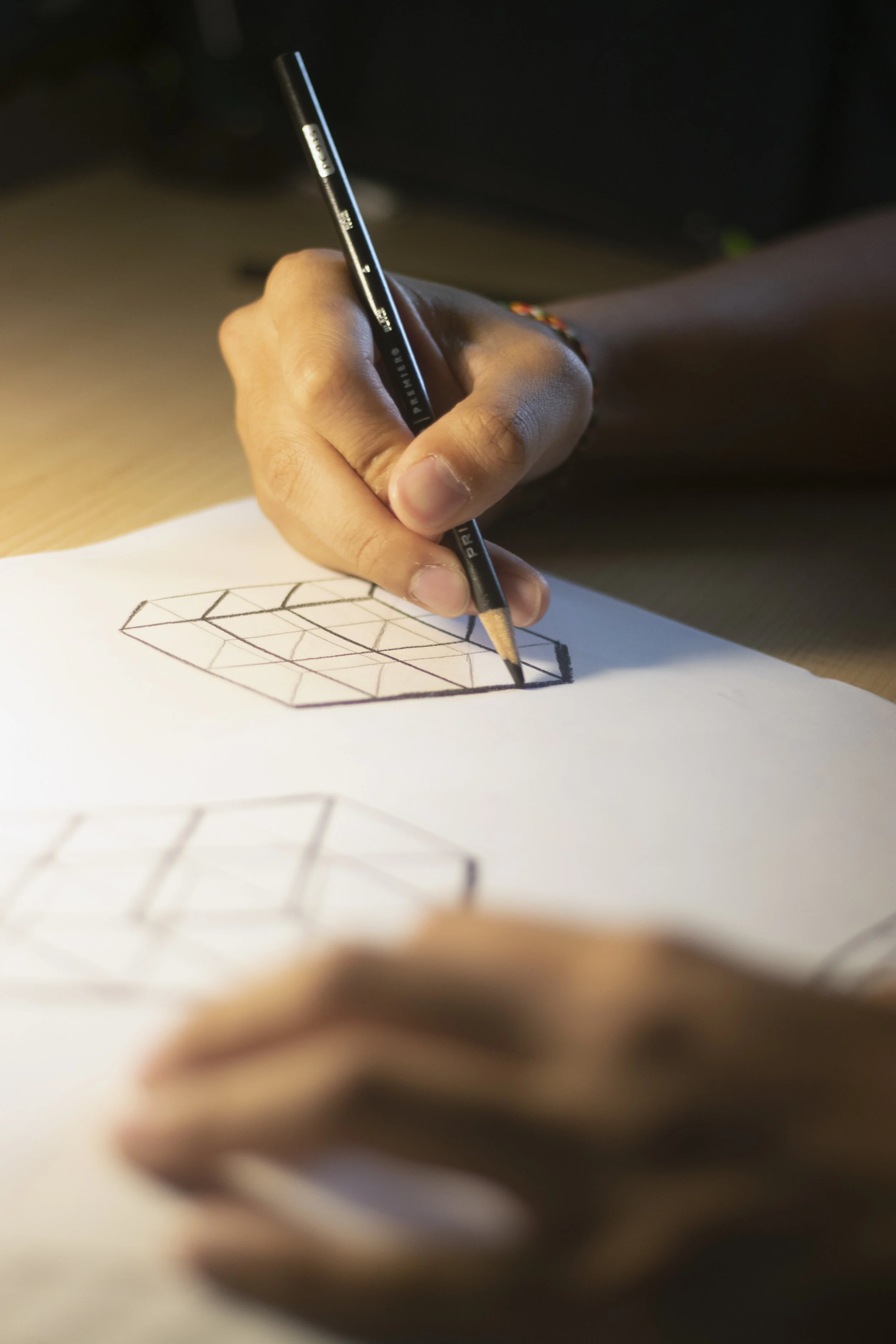 Dao works diligently on a perspectives assignment for one of his industrial design courses. Photo by Marijke Pieters-Kwiers