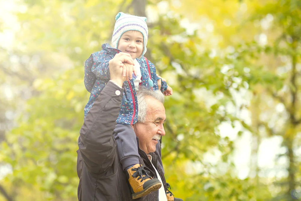 grandpa carrying grandkid