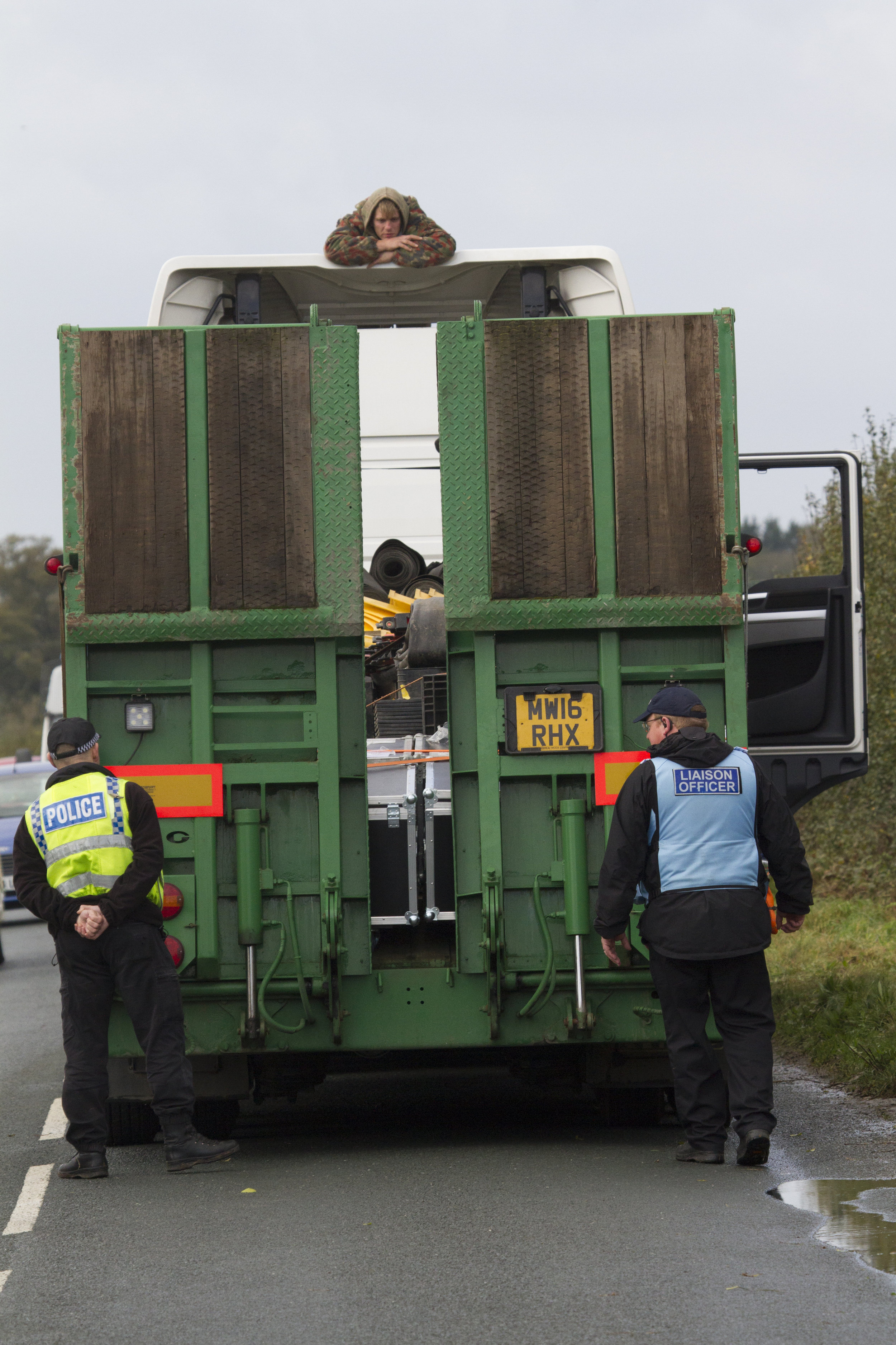 An activist surfs a lorry in Kirby Misperton. Photo courtesy of Yorkshire's Fracking Frontline