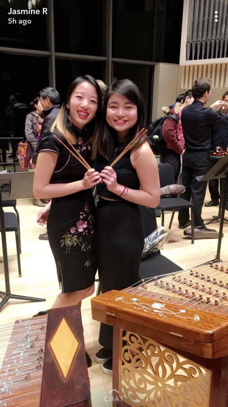 Wang (right) with fellow yangqin instrumentalist Liao after their performance. (Photo courtesy of Liao)