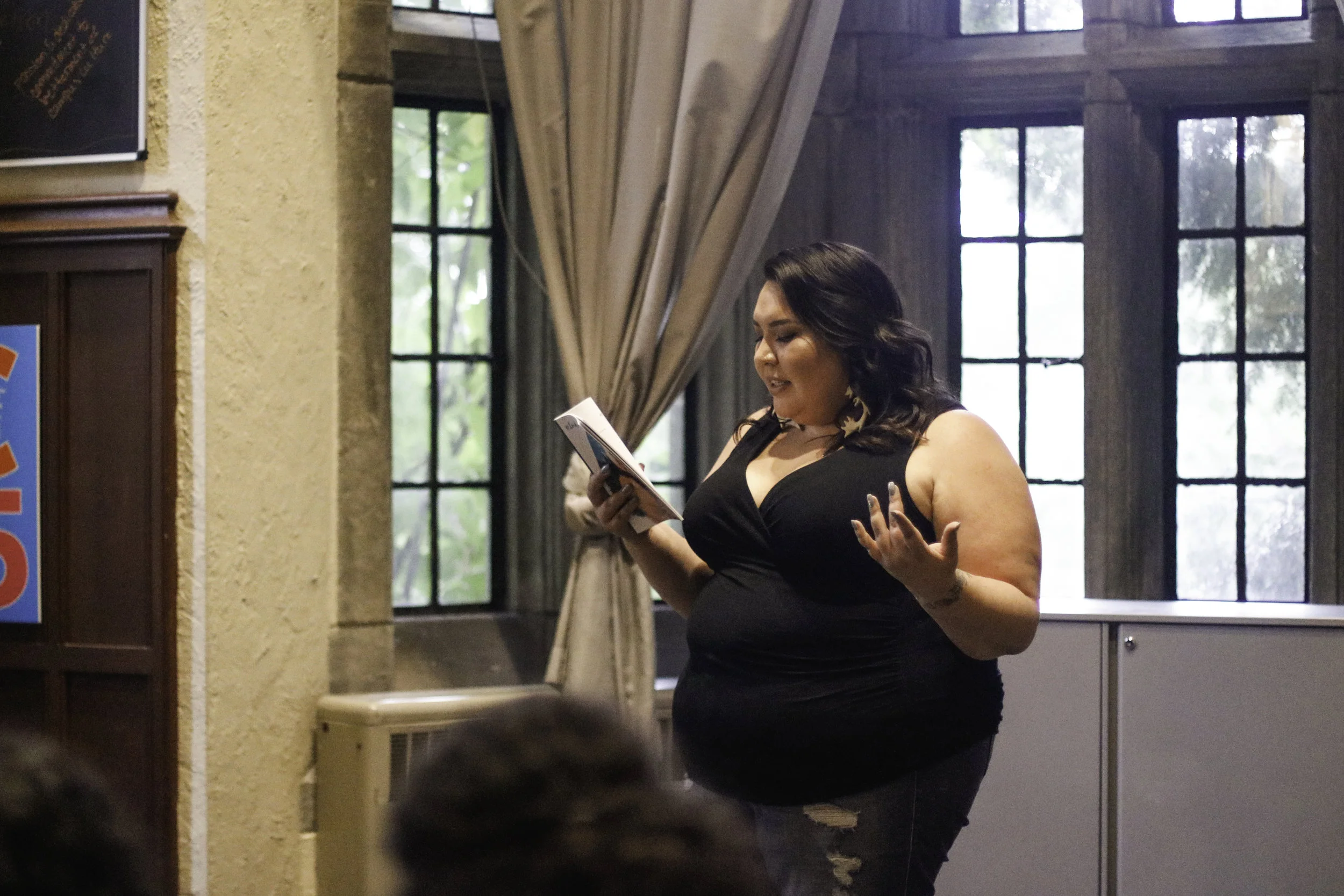 Campbell reads to the crowd.