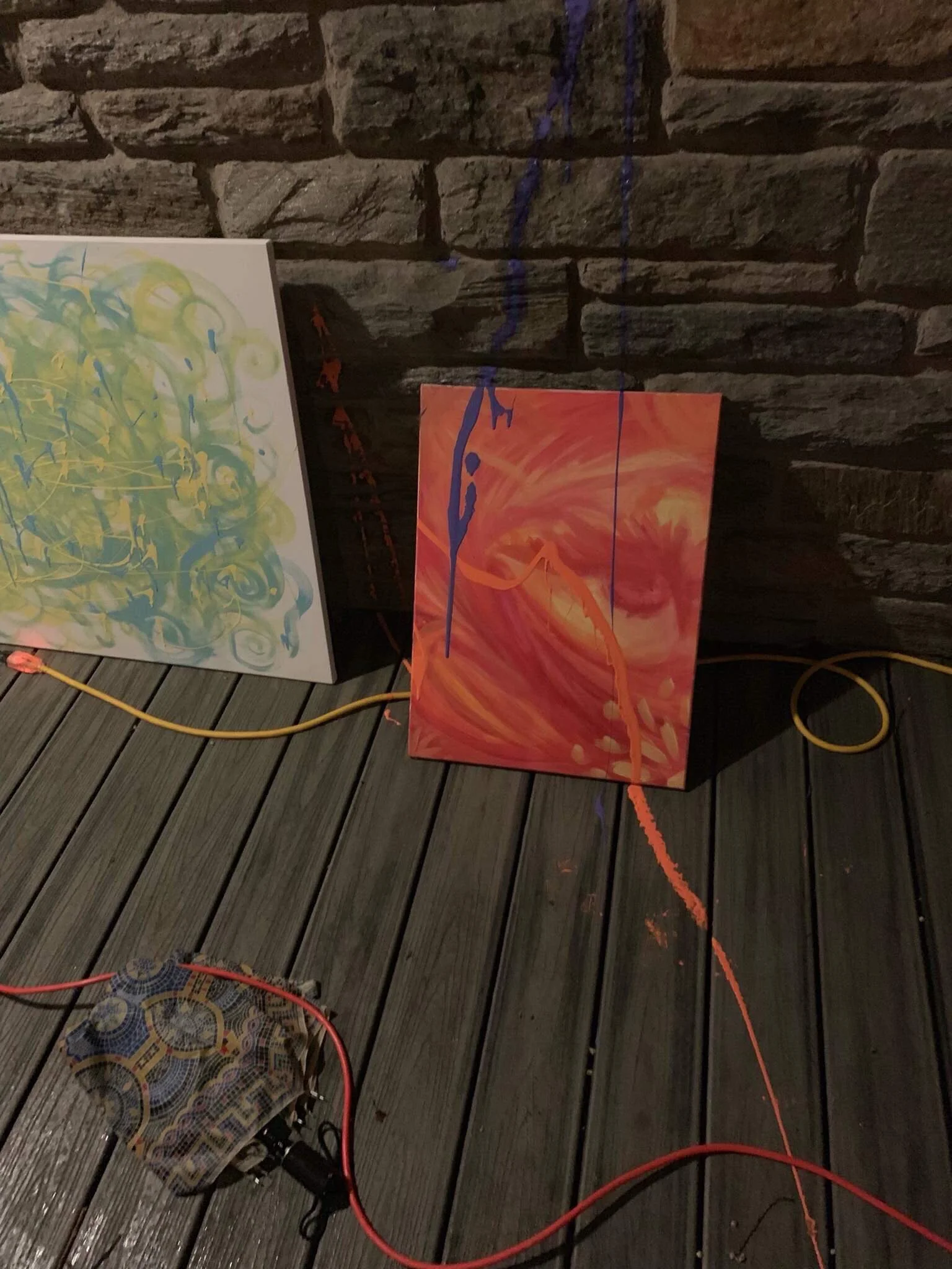 Paint on student artwork outside the Intercultural Center.
