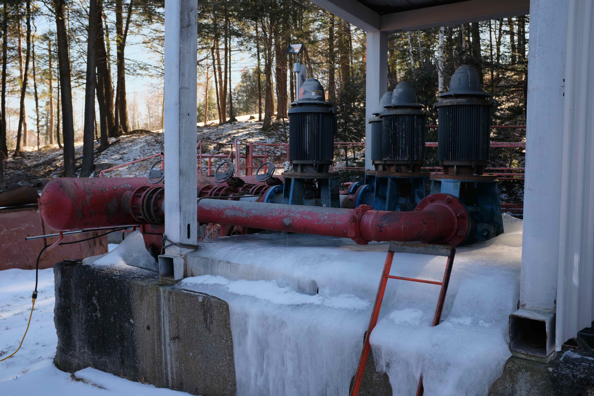  The pumps that circulate water to be chilled. If the power were to fail for more than a couple of minutes while water was in this system the entire apparatus could be destroyed in the ensuing freeze. By keeping the water in motion in a closed system