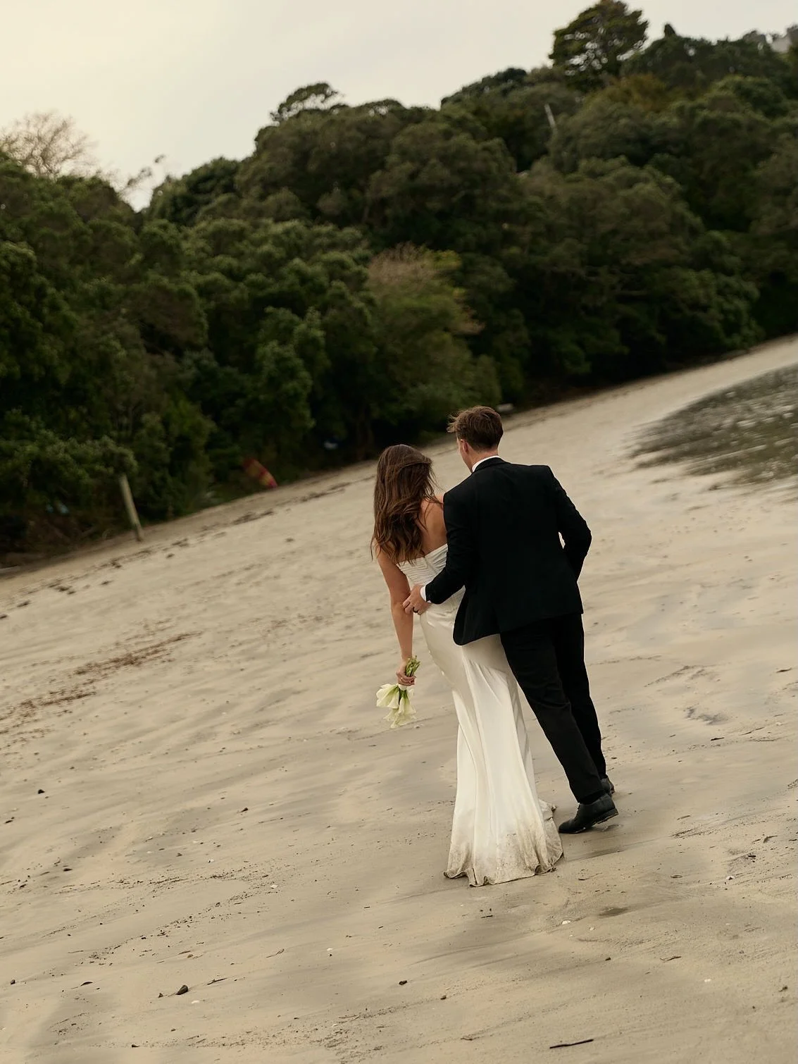 The most gorgeous elopement for K &amp; B at Oneroa beach squeezed in before the cyclone hit 🏹

Planning @mywaiheke 
Photographed by @byparistilley 
Celebrant @marriedbyria 
Florals @madameflorist.waiheke 
Hair @madeleinedoeshair @yuduyuhairsalon 
M