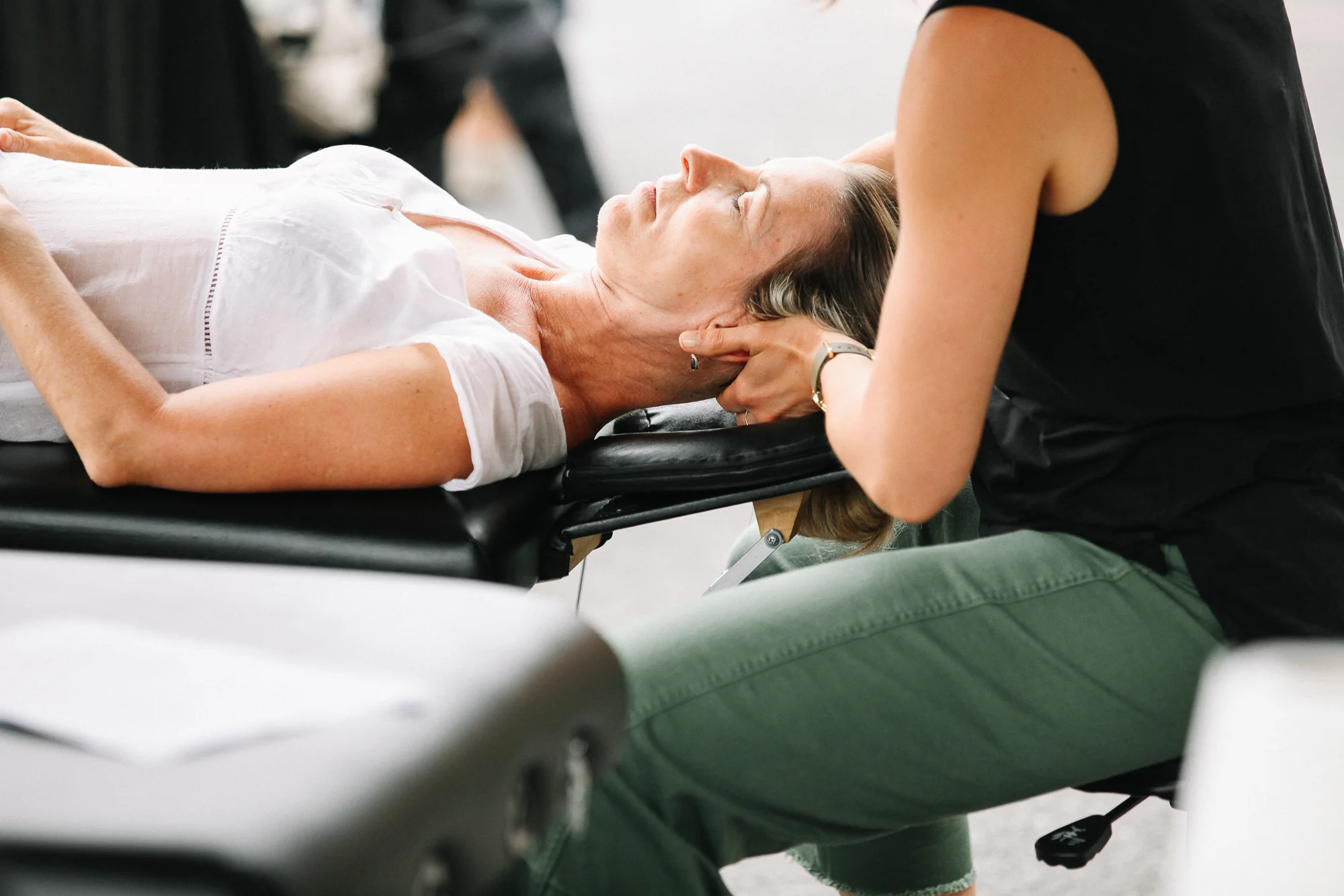chiropractor, Dr. Andrea providing neck treatment