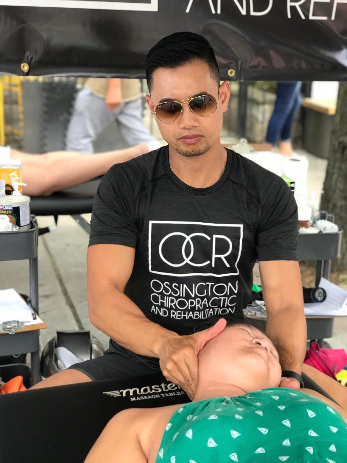 chiropractor, Dr. Glenn providing neck treatment