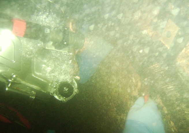 Diver attaching bracket to the bridge pier