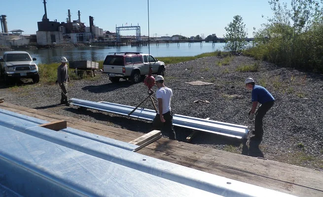 Custom built stop log guides offloaded at site
