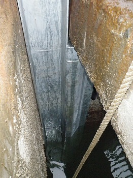 Stop log guide positioned and ready for anchor bolt installation and grout