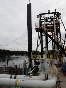 Lowering up river transition plate into place