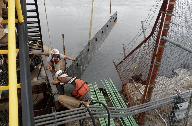 Lowering down river transition plate into place