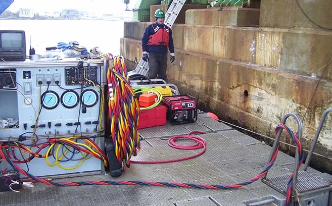 Surface supplied diving set up for bridge repair.