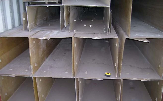 Fiberglass jackets await prep work before installation at shipping port.