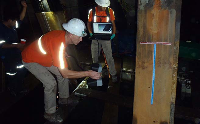 techs-laser-scan-pile-for-qc.jpg