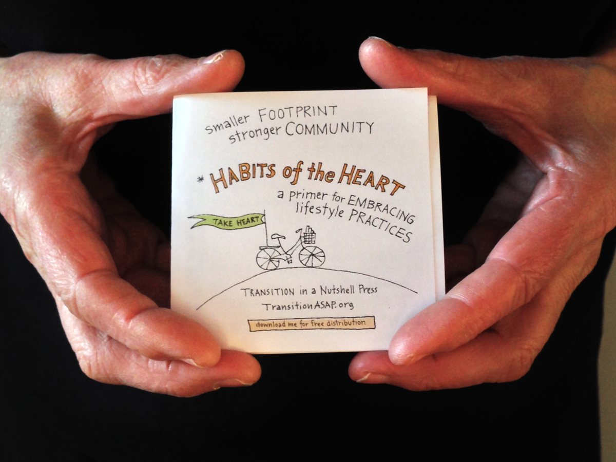 One of hundreds of tiny books handed out in conjunction with the Grove of Life at the Gage Family Art Gallery and elsewhere. Copies can be downloaded for free at TransitionASAP.org . Photo by Michael Russelle.