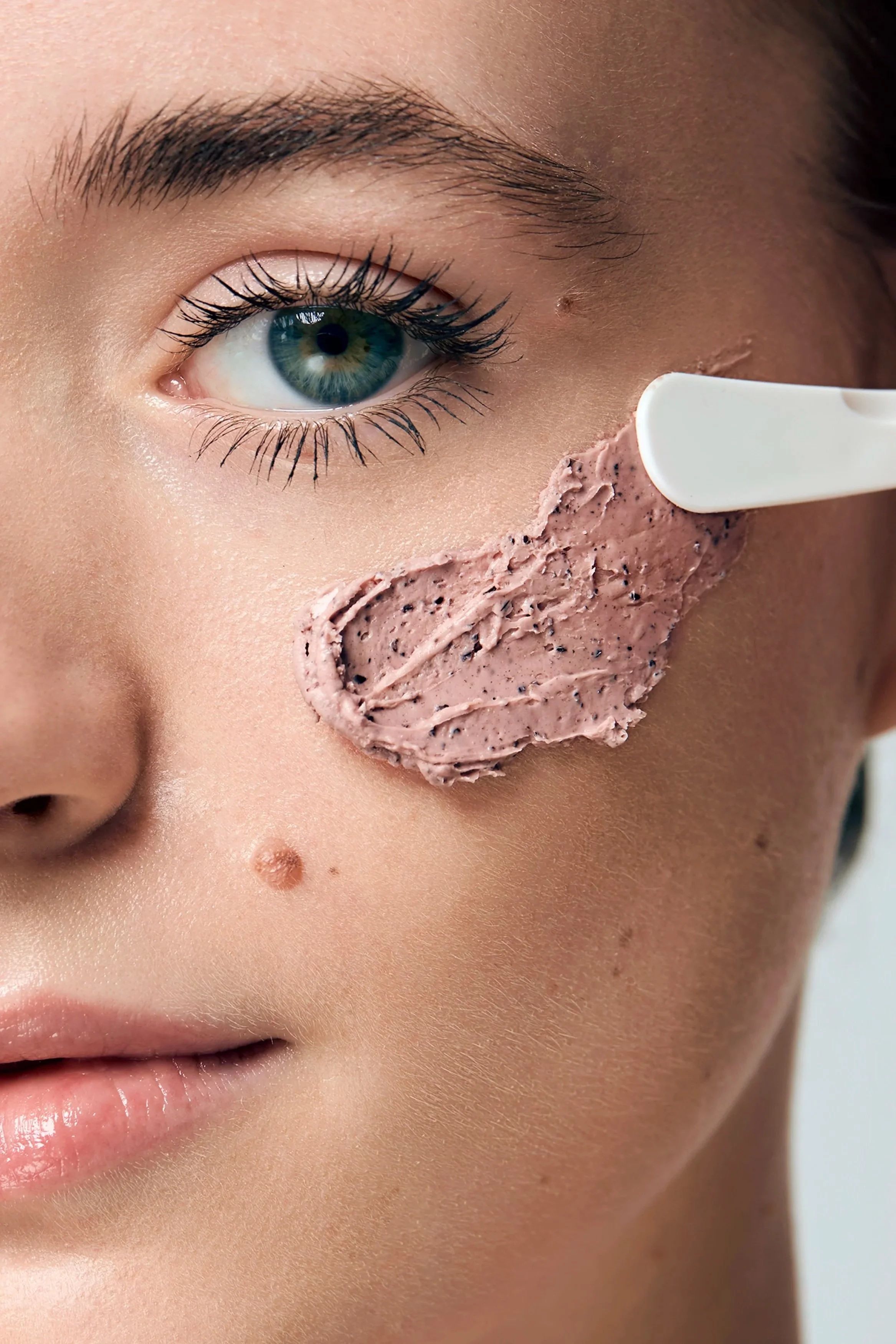  close up of face mask swab on the cheek, skincare photoshoot, beauty photography, skincare photography, Egle Vasi, beauty photographer, beauty photographer London, beauty photographer Bristol 