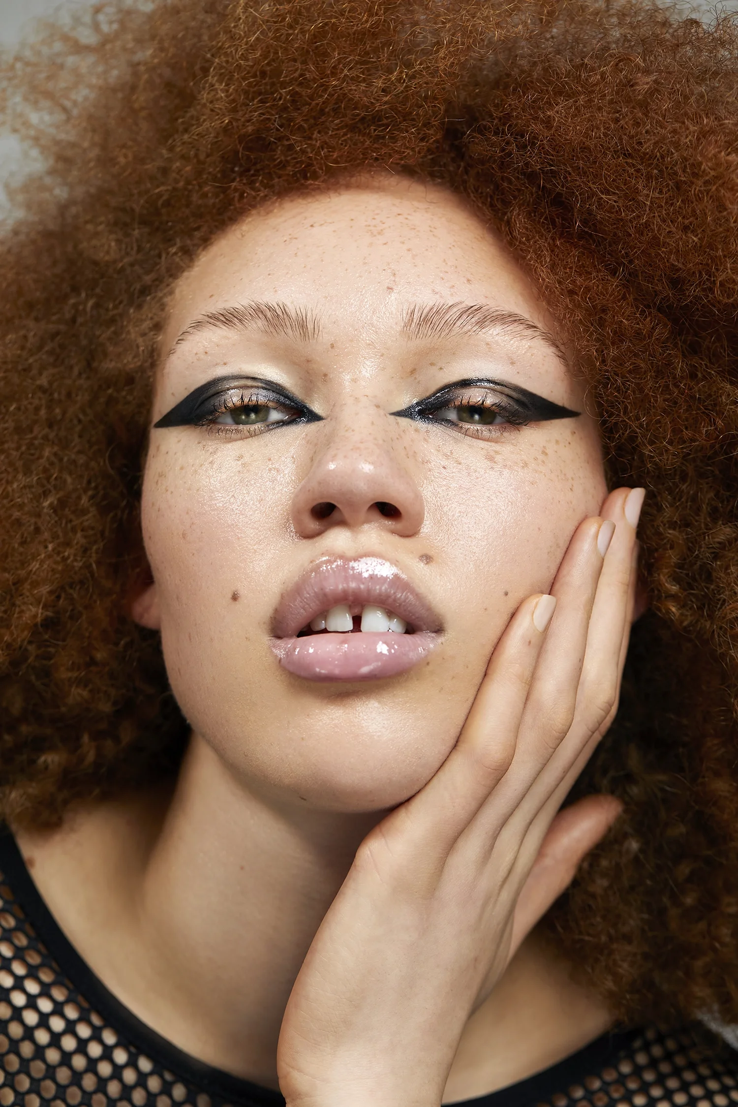  model with freckles and bold eyeliner, beauty, beauty photography 