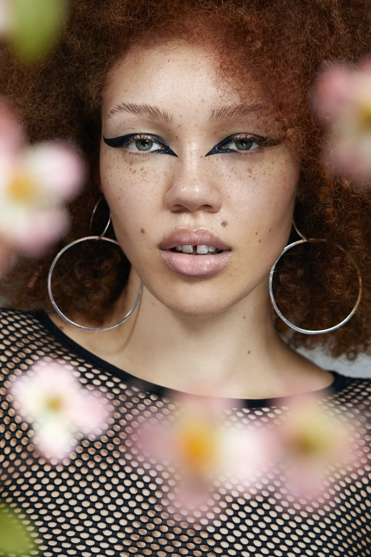  model with freckles and bold eyeliner, editorial, beauty photography 