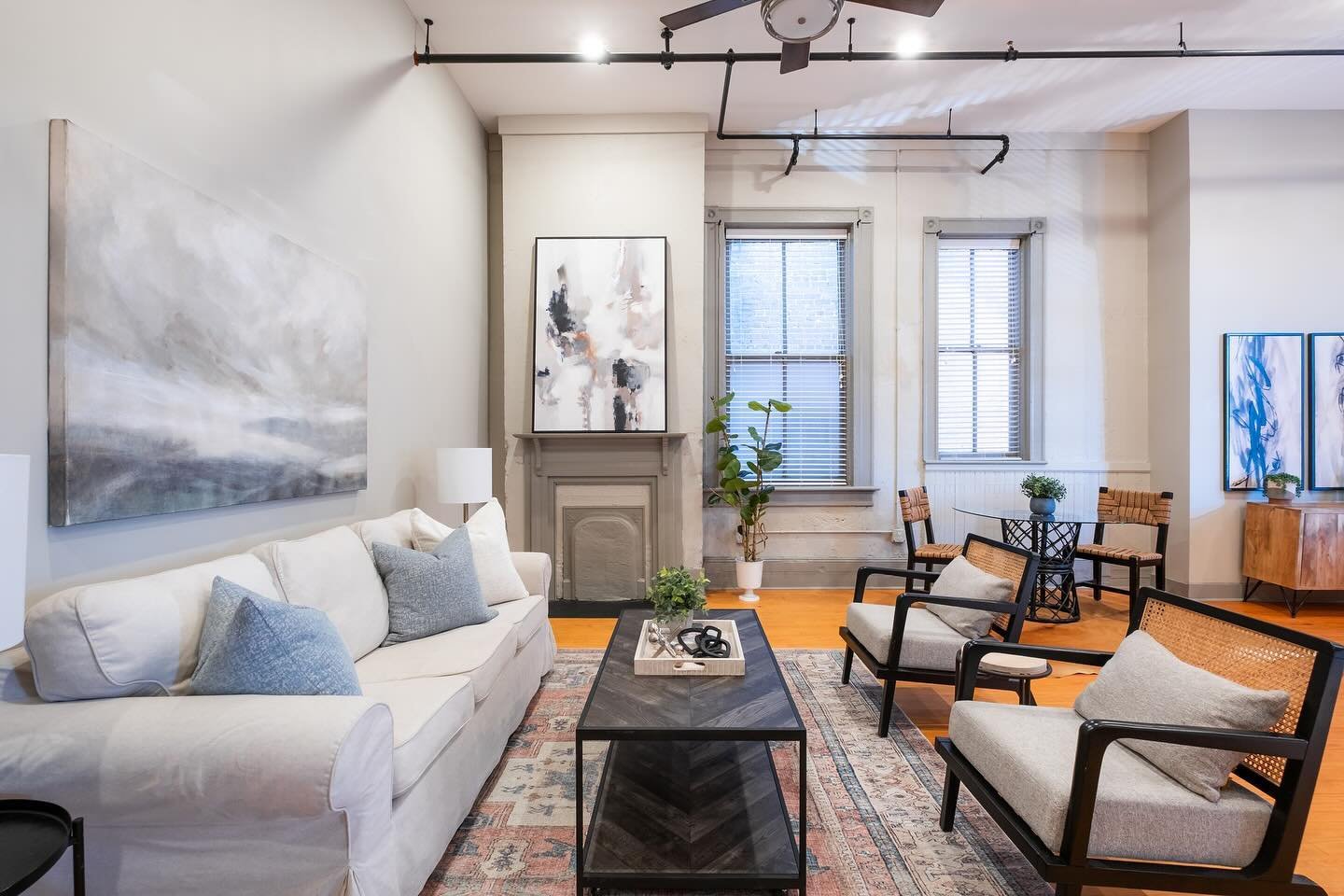 We love an open floor plan loft around here at A|T. Designing a space that otherwise feels overwhelming, designating the spaces helps bring the home to life and see a vision behind just an open room.