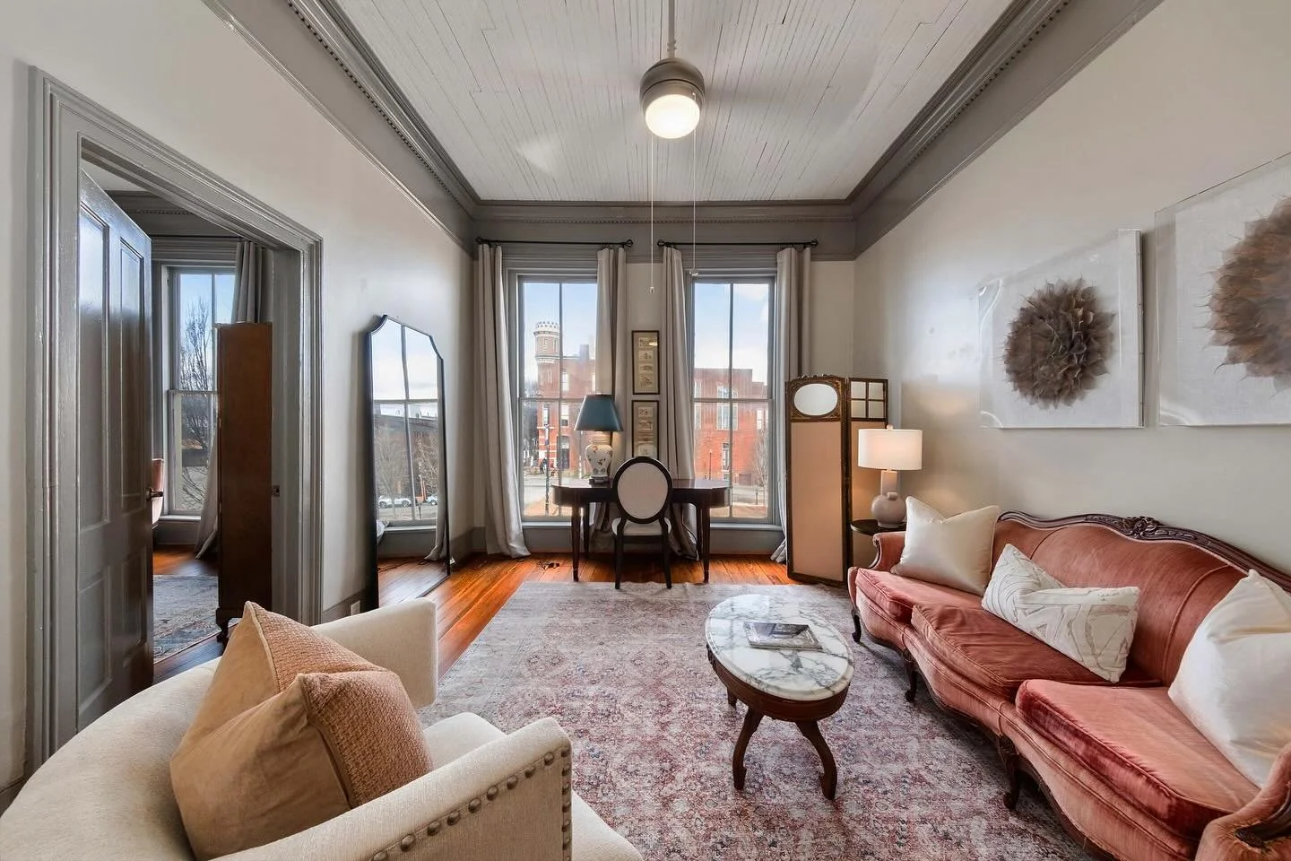 Step into this beautiful downtown loft condo we renovated and designed in Macon, Ga. We wanted to keep the original historic feel with an updated look. We kept the integrity of the space with original heart pine floors and heavy crown and dental mold