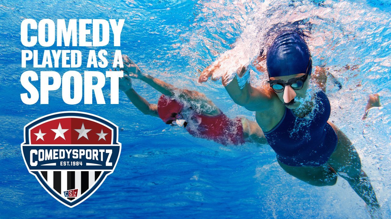 Two women swimmers racing and both are wearing funny rubber noses, glasses and moustaches