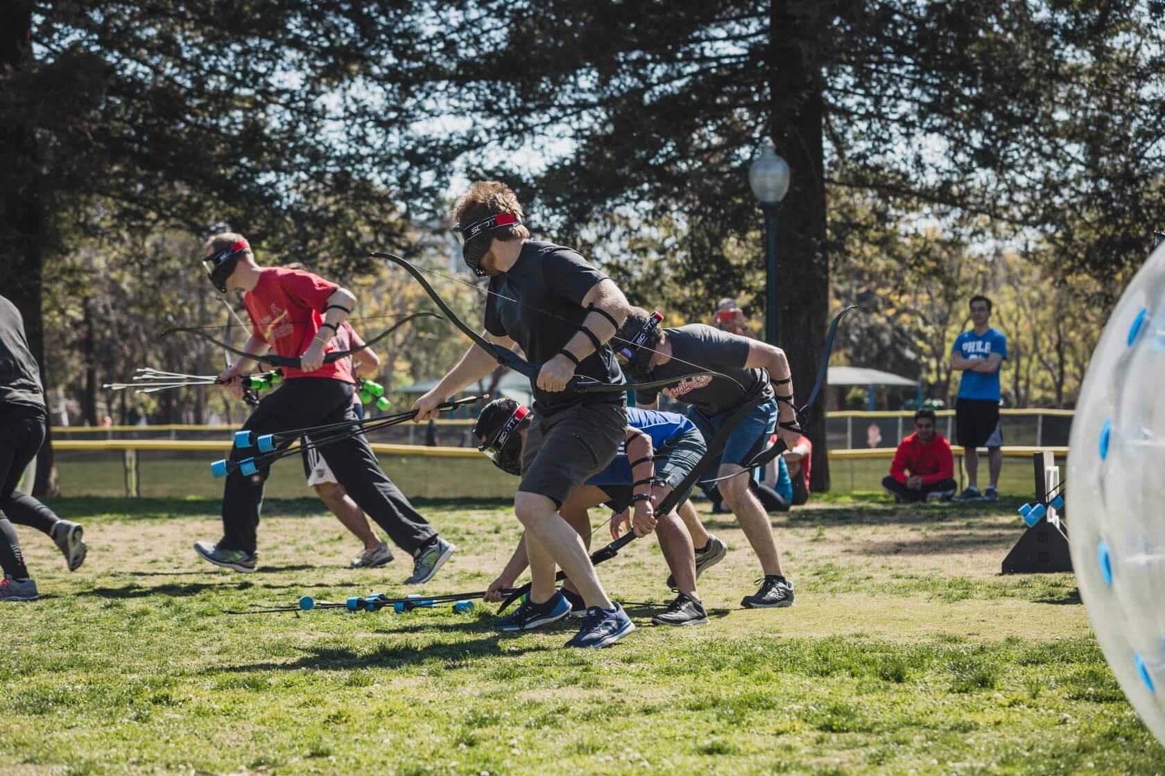 Players run to the middle to obtain Arrows | Archery Tag by AirballingLA 