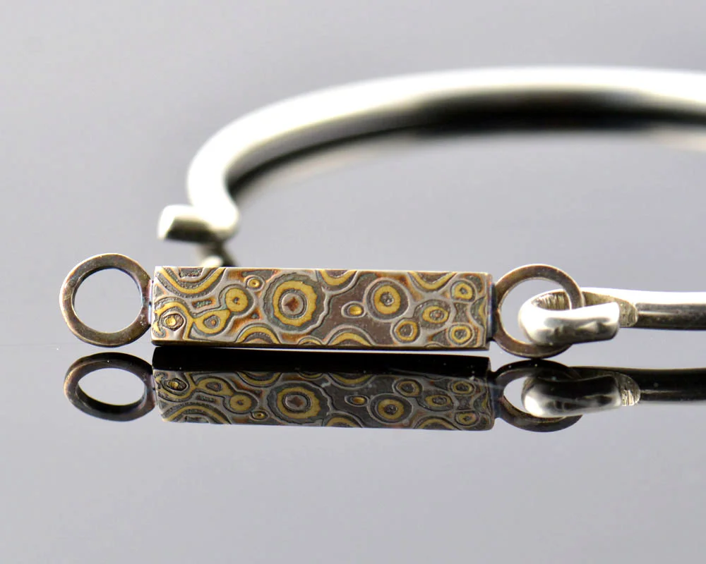 Rain - 18k yellow gold and palladium with a wild liver of sulfur patina