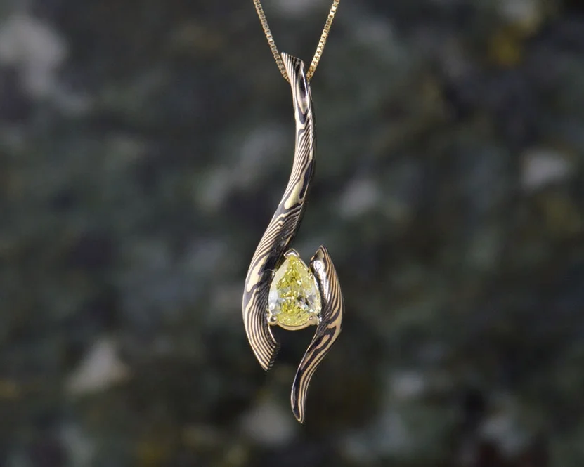 Pendants like this yellow pear diamond and other classic accessories are yours to design.