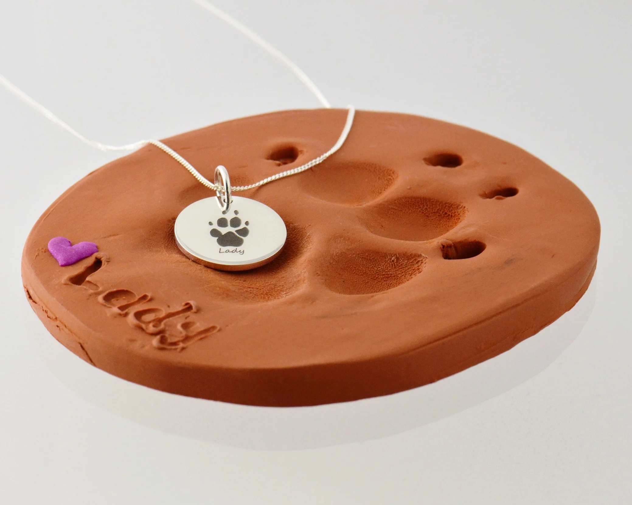 Remembrance in the form of paw print or nose print engraved pendants. We make too many of these, but always will.
