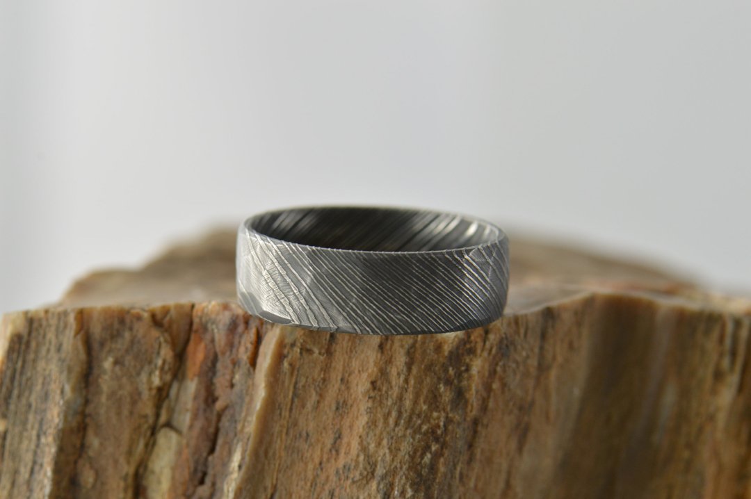darvier-faceted-carbon-damascus-ring.jpg