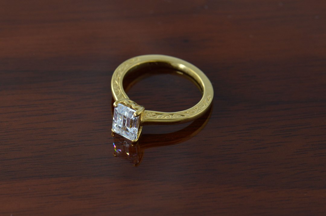 darvier-emerald-cut-diamond-18k-carved-engagement-ring.jpg