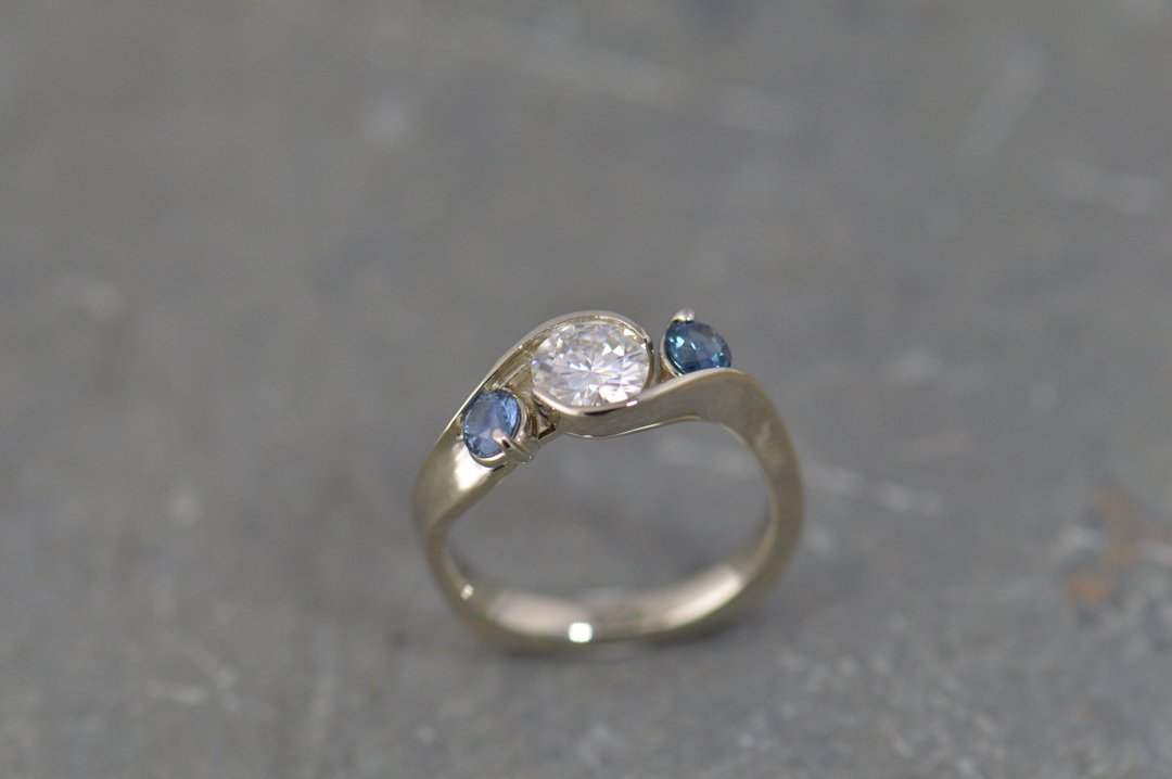 darvier-three-stone-twist-diamond-sapphire-engagement-ring.jpg