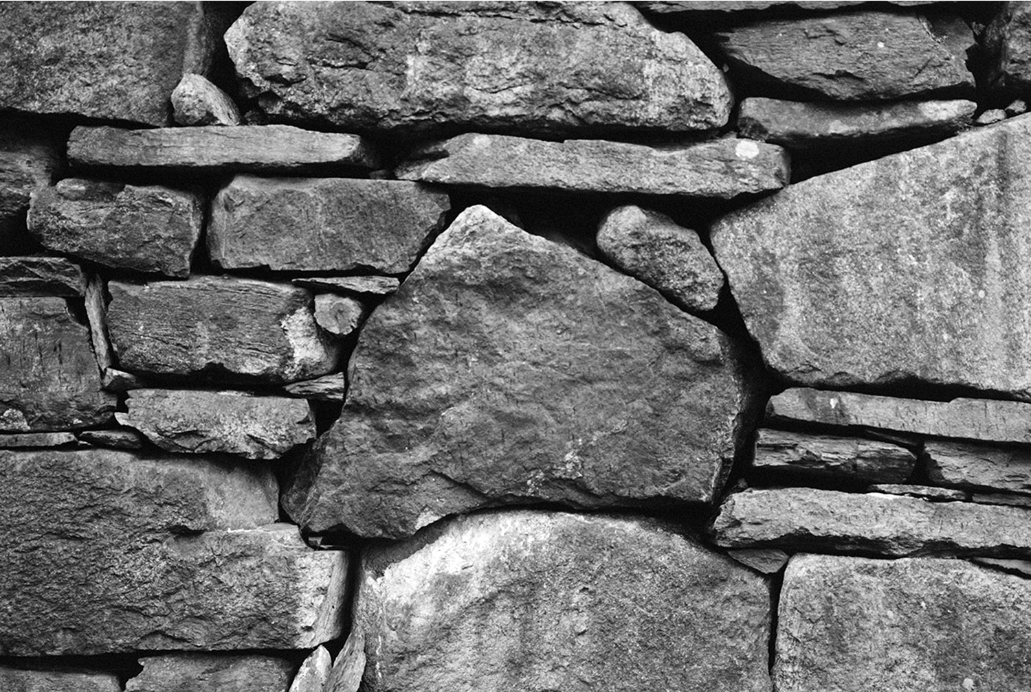   Source image no. one: photo of a dry wall, possibly build by Håkon Adalsteinsfostre.   Analogue 4x5, b/w photograph.  