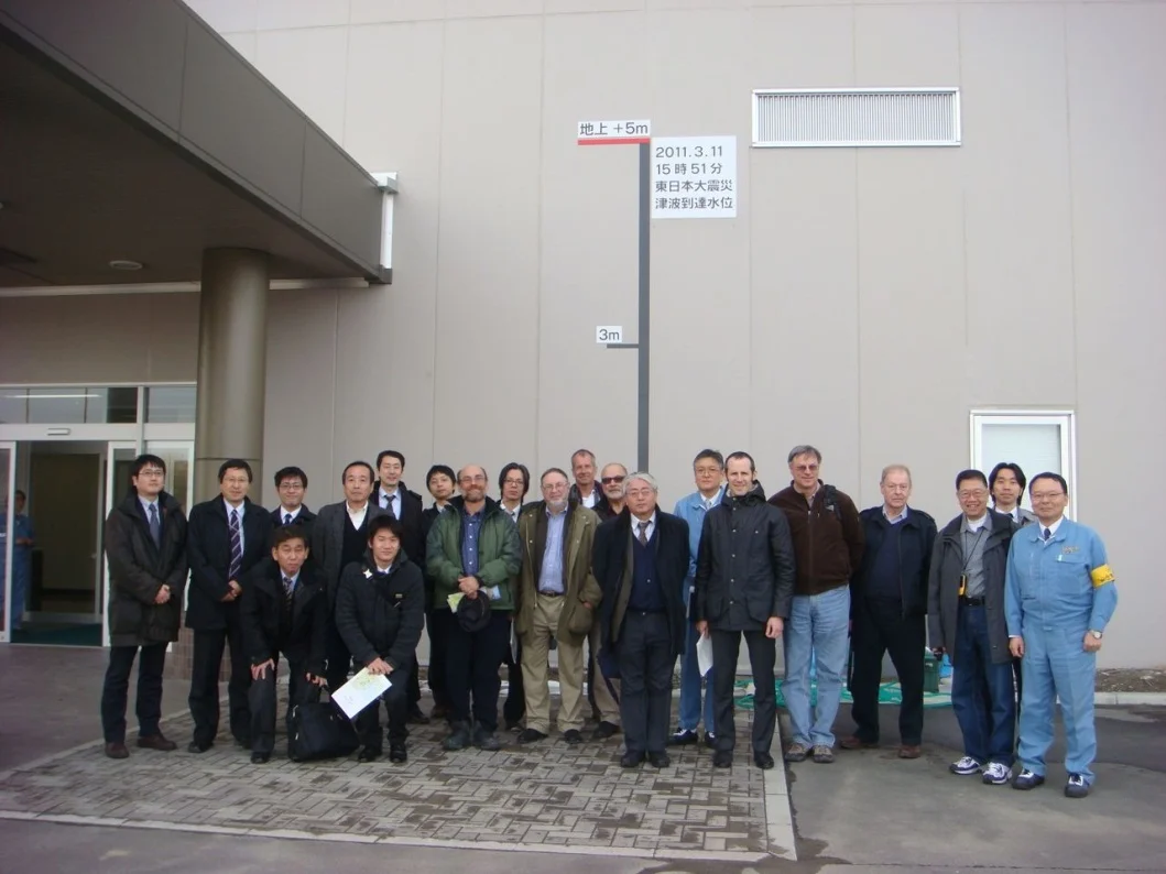 Figure 8 - Tour Group at Sendai Thermal Power Plant next to tsunami height measure